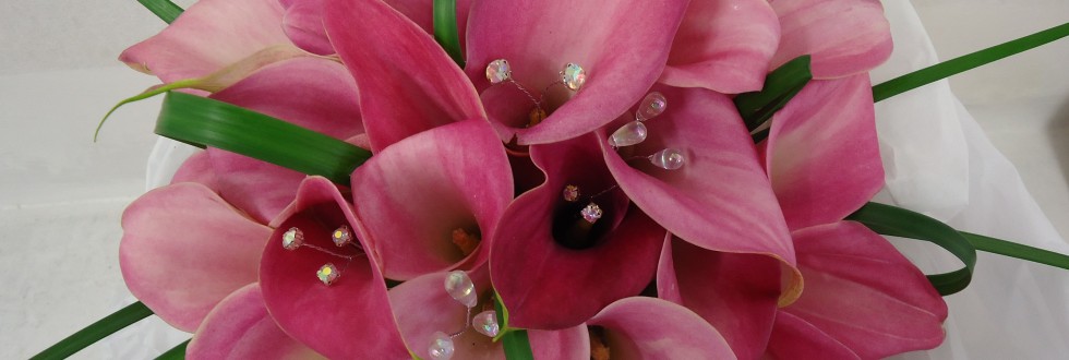 Pink calla Hand tied bouquet with iridescent crystal and looped grass