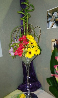 Contemporary look of gerbera, alstromeria, freesia & iris with flexi grass