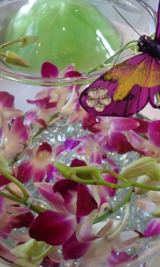 Goldfish bowl with pink singapore orchid