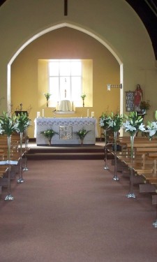 Floor vases containing ivory lilies phoenix palm and blackened ting
