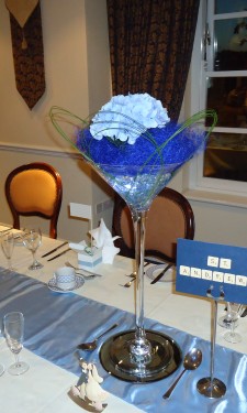 Light blue hydrangea with navy sisal and flexi grass loops in a martini vase