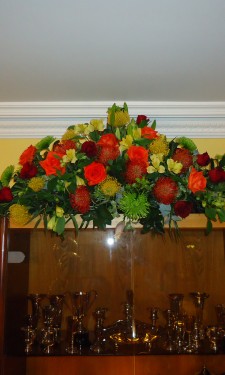 Mixed autumn colours provided by proteas, roses, chrysanthemum and alstromeria
