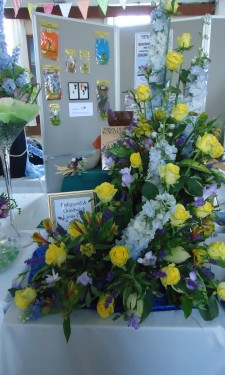 Yellow roses and alstromeria, purple freesia, blue delphiniums