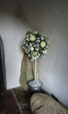 Topiary tree with ivory roses, carnations lizianthus and eucalyptus