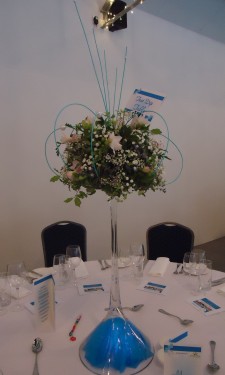 Table arrangements with freesia, gysophila and midelino sticks