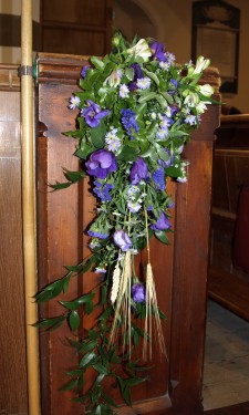 Pew end with purple lizianthus & pink alstromeria