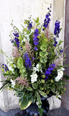 Urn arrangement with mixed flowers