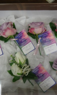 Lilac rose buttonholes & Ivory rose corsage